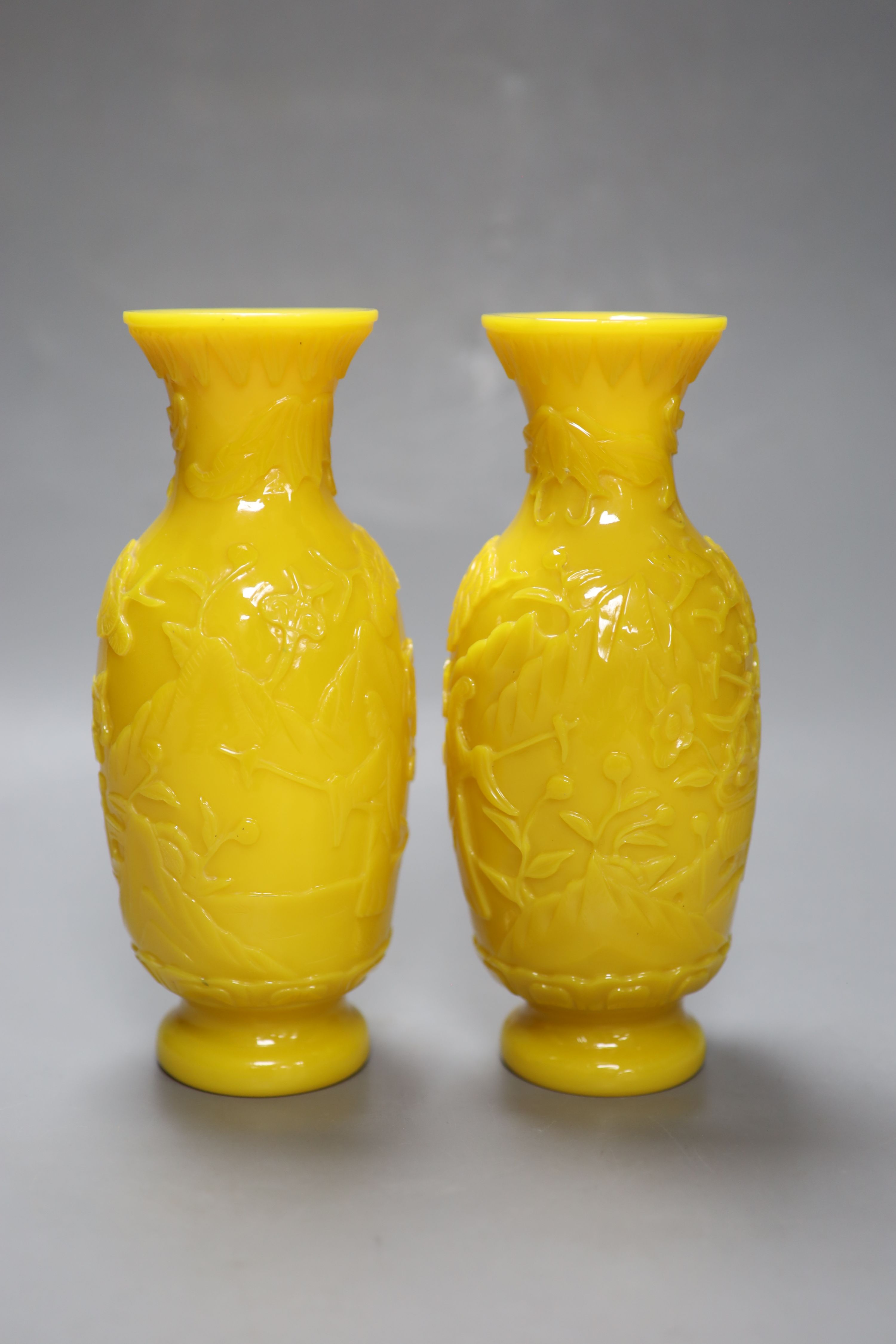 A pair of Chinese Beijing yellow glass vases, c.1900, height 21.5cm